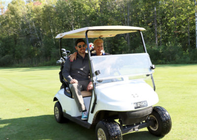 HRPAR team members driving golf cart